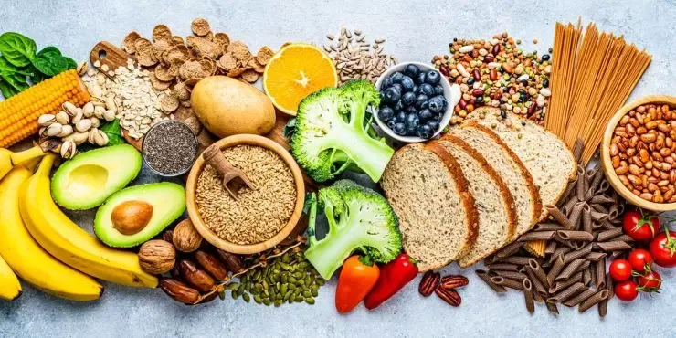 Fresh wholesome ingredients — avocados, grains, seeds, bread and vegetables